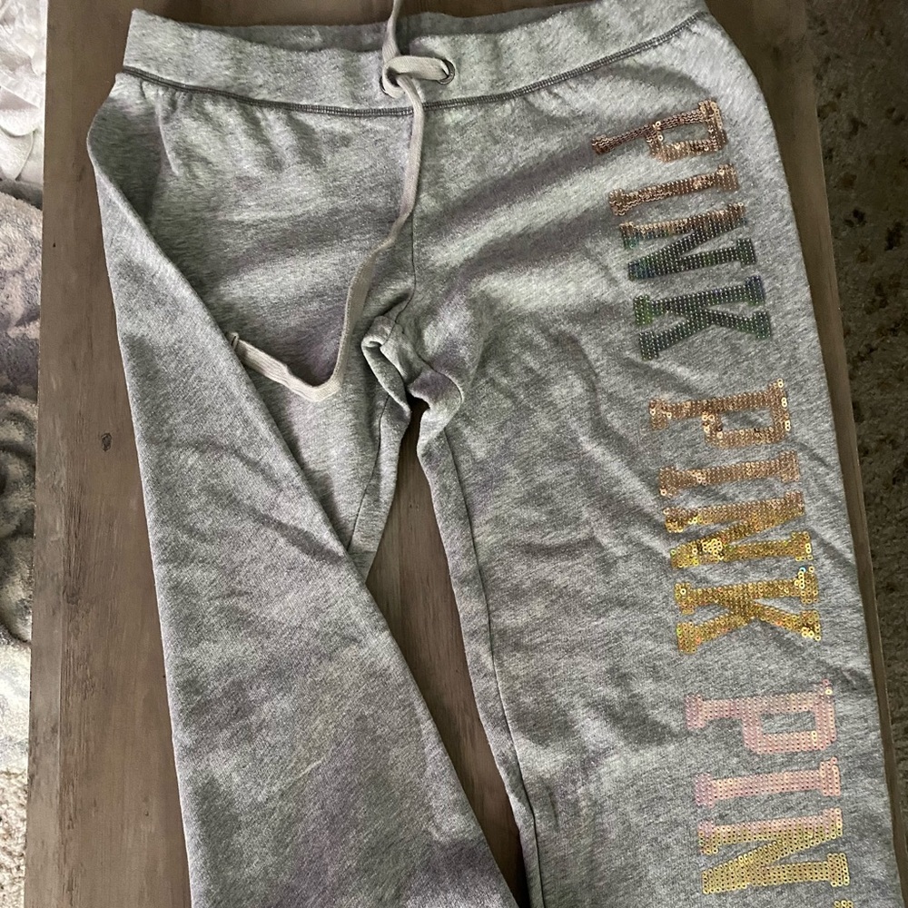 Pink joggers with sequin letters on the side